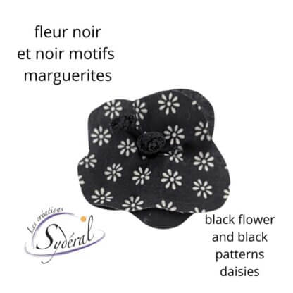 fleur décorative sur épinglette noir motifs marguerites blanches et noir